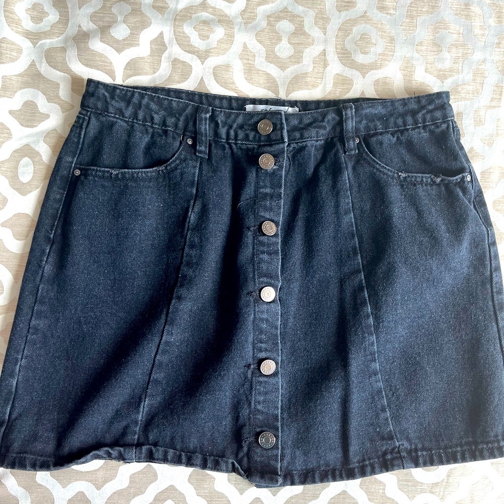 Black denim mini skirt with brushed nickel buttons